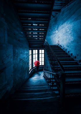 Red Umbrella on Staircase