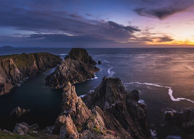 Sunset Over Rugged Coastline