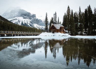 Cabin by Frozen Lake