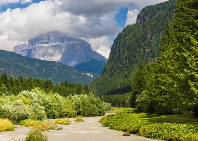 A viev of Sass Pordoi and Avisio river in Val di Fassa - Italy