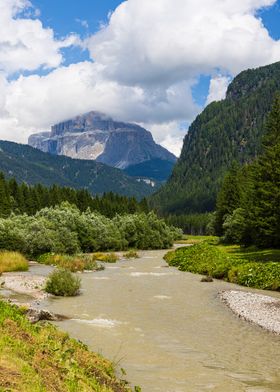 A viev of Sass Pordoi and Avisio river in Val di Fassa - Italy