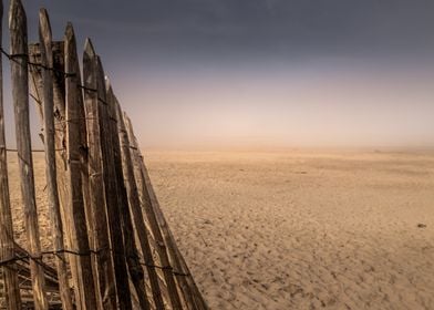 Wooden Fence on Sandy Beach