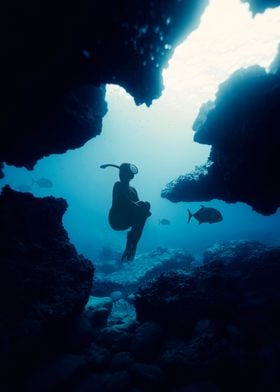 Diver in Cave Ocean