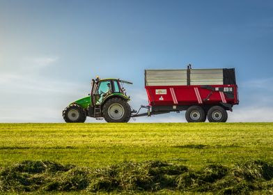 Green Tractor with Red Trailer