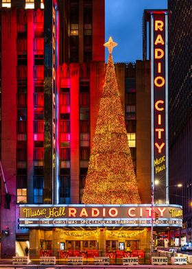 Radio City Music Hall in New York City with Christmas Tree at night