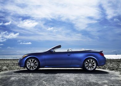 Blue Convertible Car on Beach