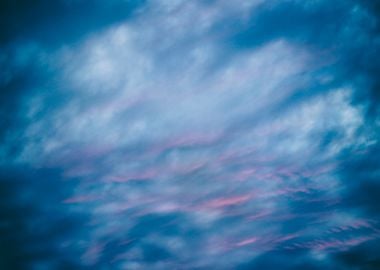 Photograph of a blue and red cloudy sky on sunset