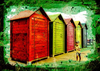 Boy running along beach sheds in Valencia, Spain