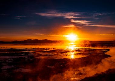 Amazing sunrise at thermal lake & flamingo birds