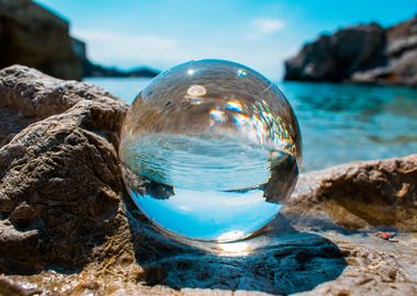 Glass ball on the rocks