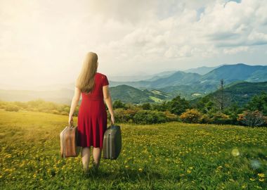 Woman With Luggage In Moun