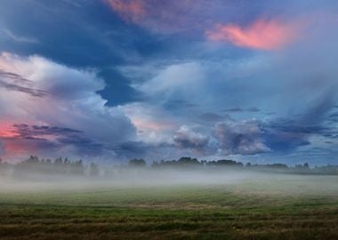 Sunset Over A Misty Field