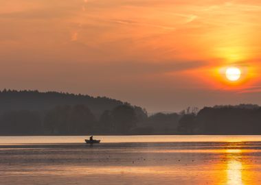 Sunset Lake With Fisherman