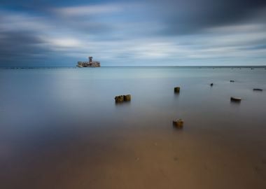 Beach With Old Military Bu