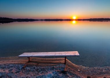 Bench On Lake Shore At Sun