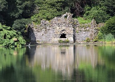 Ruins by lake with heron