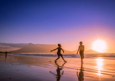 Women dancing on beach