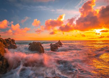 Waves crashing at sunset