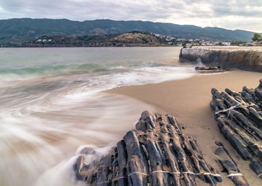 Waves rocks sandy beach