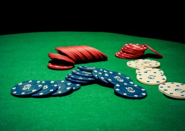 Poker chips on green table