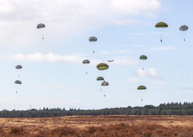 Paratroopers descend from the sky