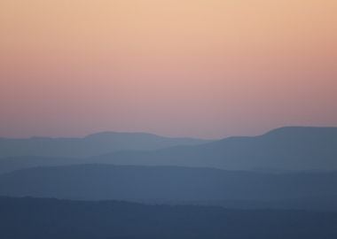 Silhouetted Mountains at Sunset