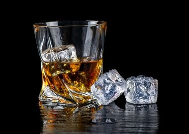 Whiskey and ice on dark