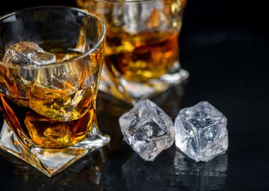 Whiskey and ice cube